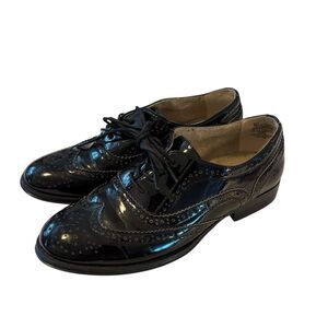 Black Patent Leather Wingtip Oxford Laced Brogues w/ Decorative Perforations.